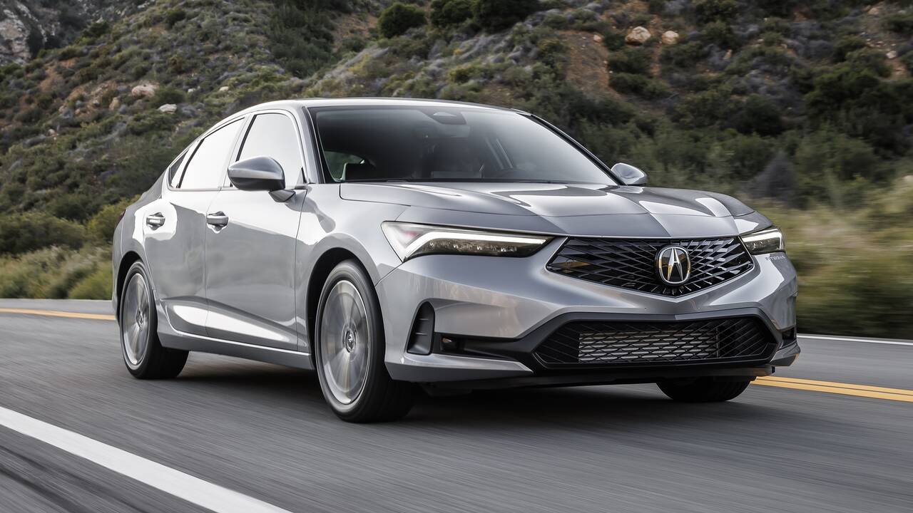 2025 Acura Integra driving on a canyon road