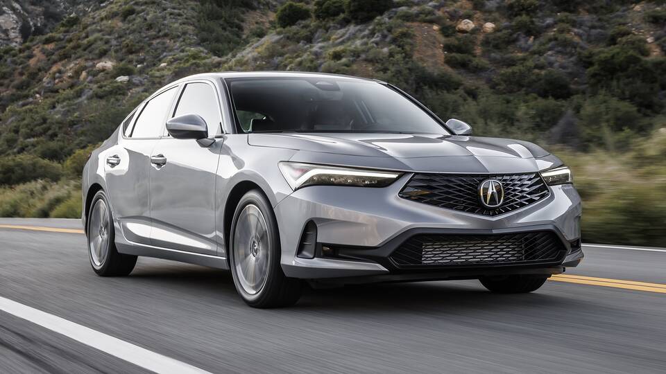 2025 Acura Integra driving on a canyon road