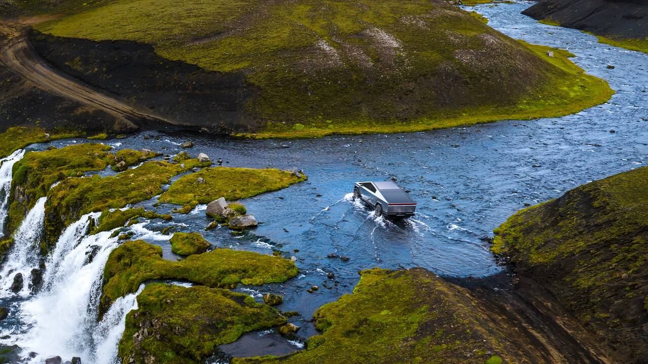 2025 Tesla Cybertruck driving drone view