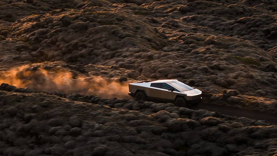 2025 Tesla Cybertruck driving in the desert