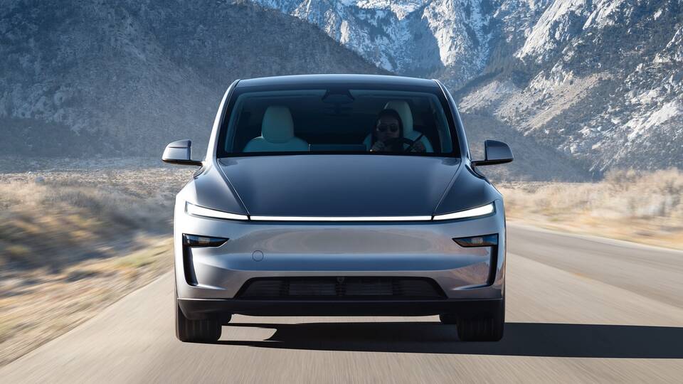 2025 Tesla Model Y driving head on
