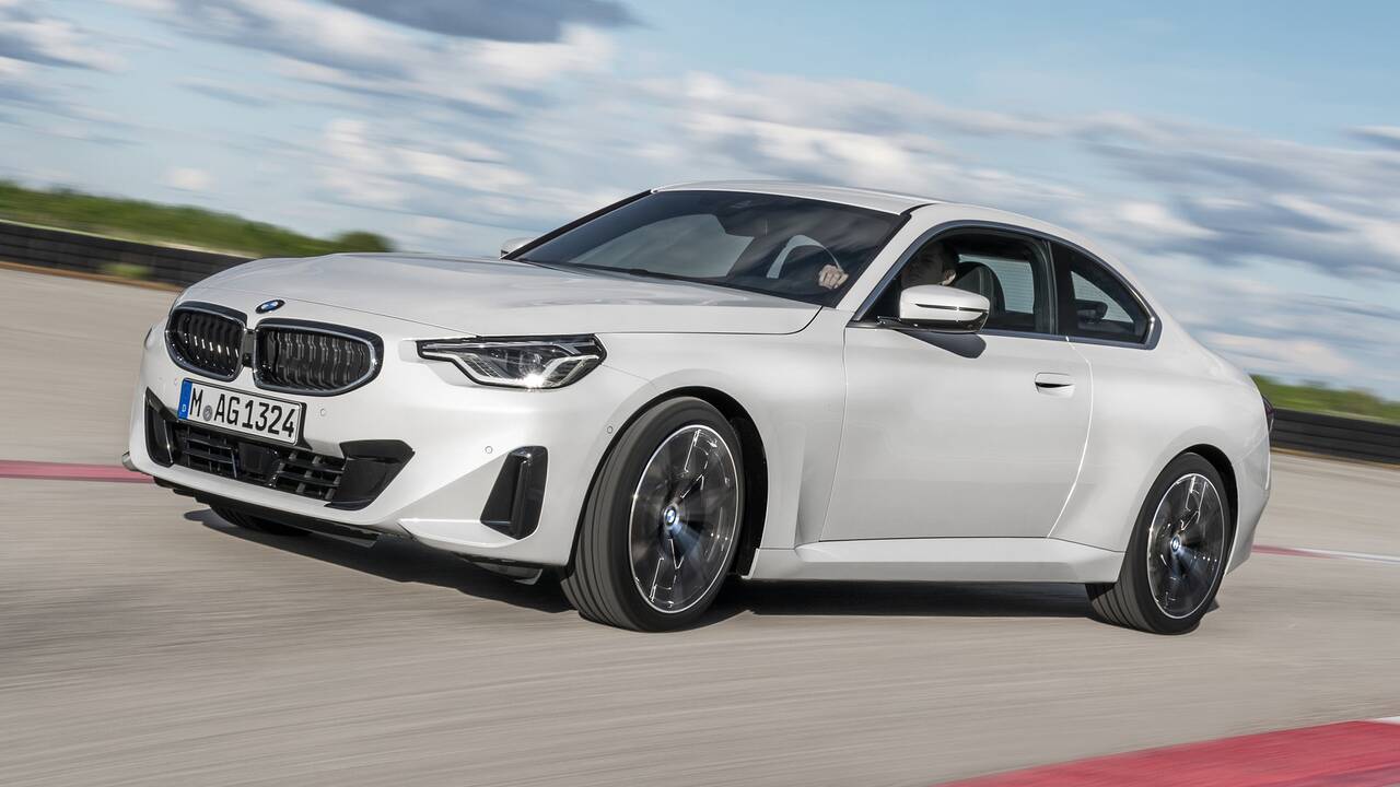 2024 BMW 230i driving front view