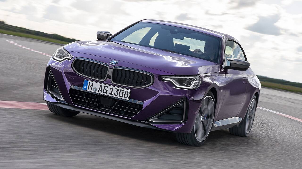 2024 BMW 240i coupe driving front view