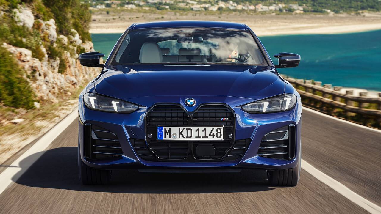 2025 BMW M440i Gran Coupe driving front view closeup