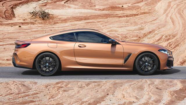 2025 BMW M8 parked in a canyon - side view