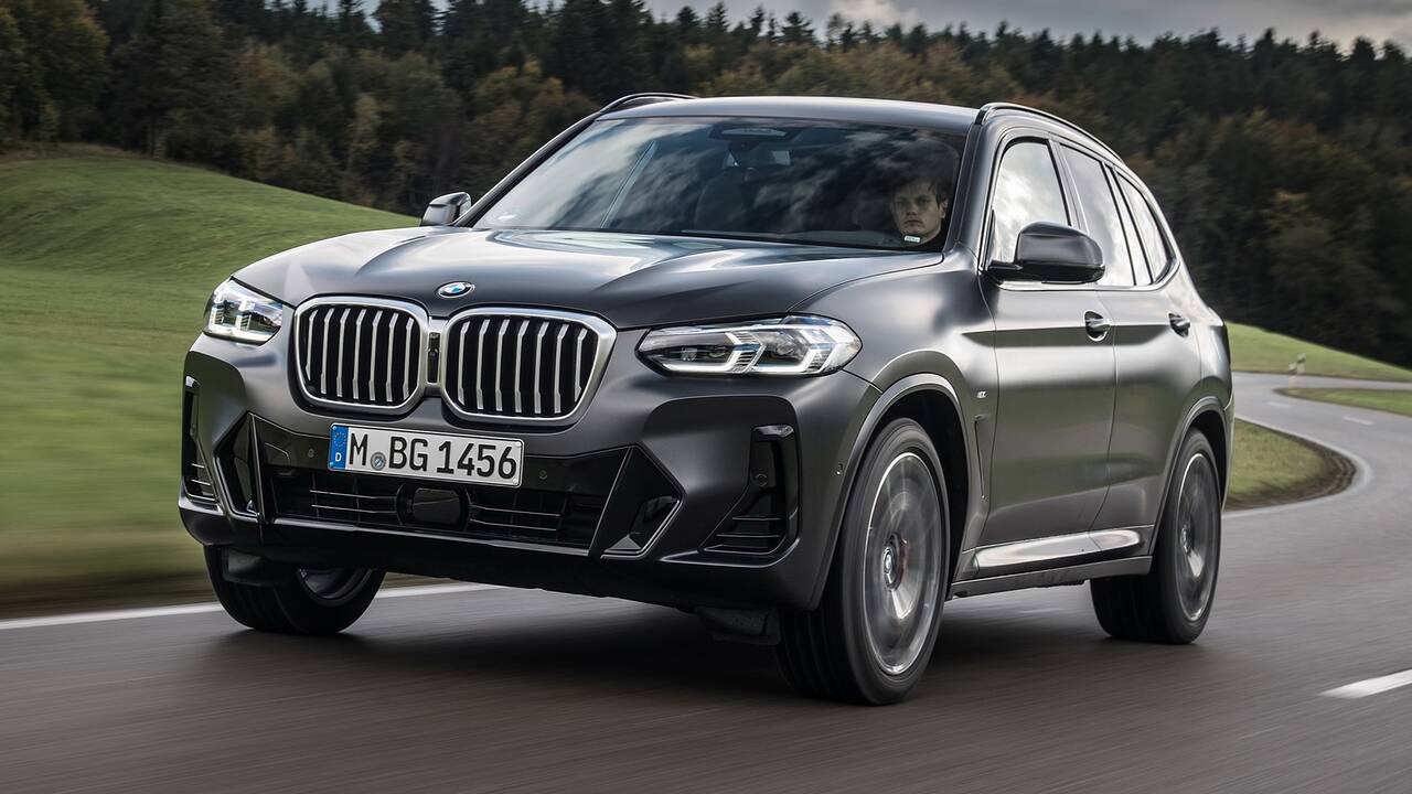 2024 BMW X3 driving front view