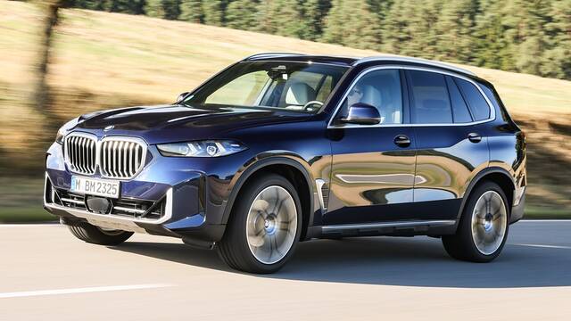 2024 BMW X5 driving front view