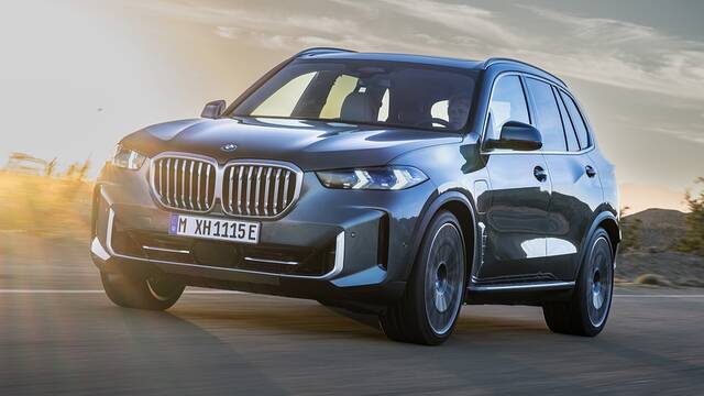 2024 BMW X5 xDrive50e driving front view