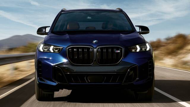 2025 BMW X5 M60i xDrive driving front view closeup