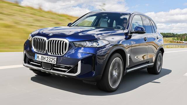 2025 BMW X5 driving front view