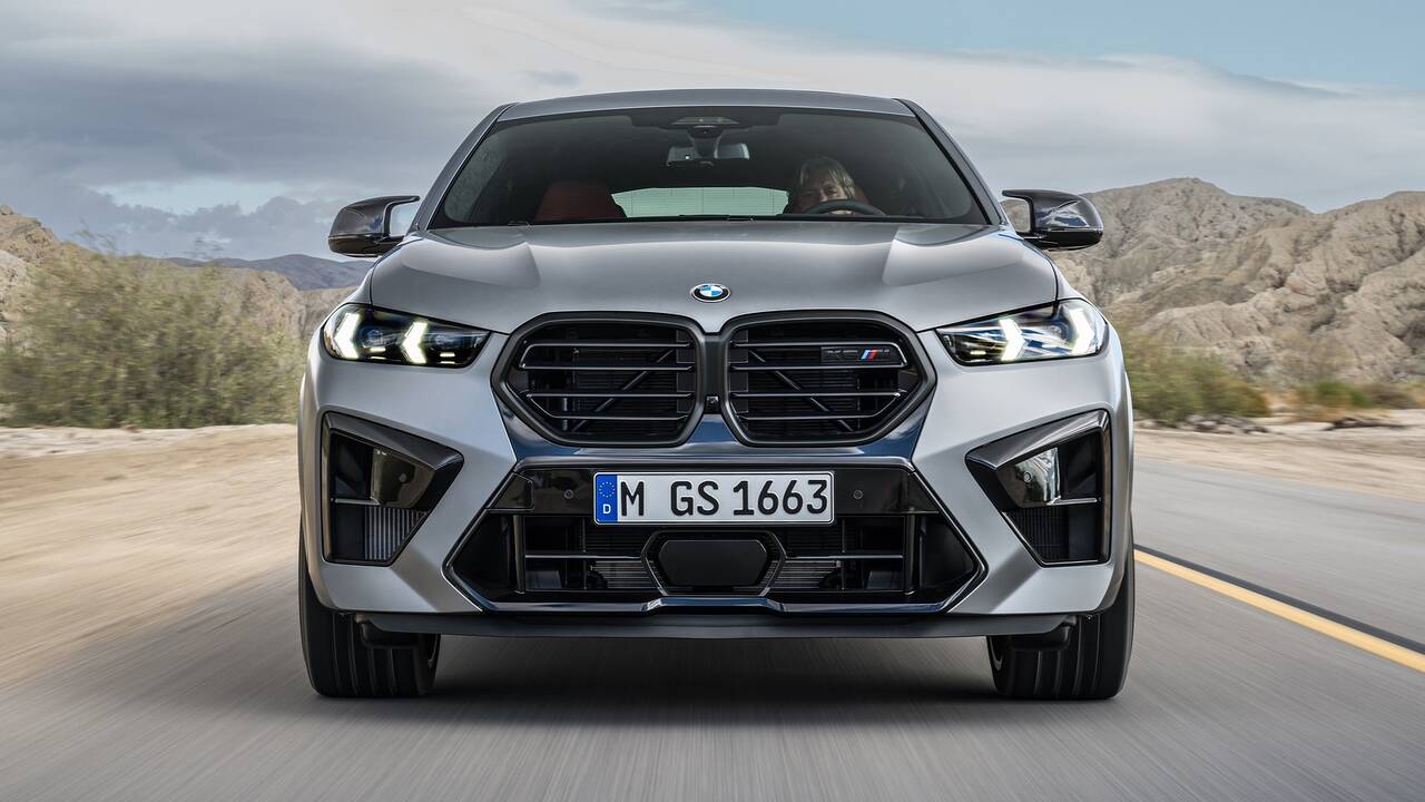2024 BMW X6 M driving front view closeup