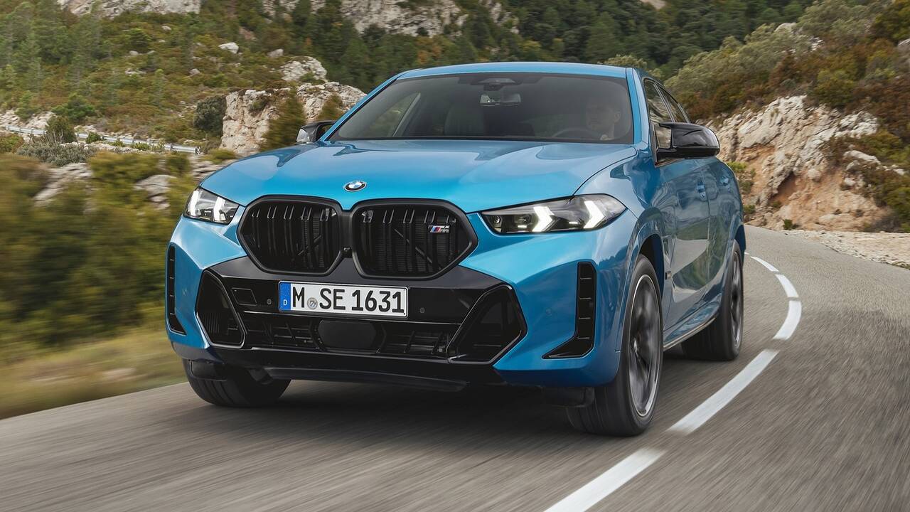 2025 BMW X6 driving front view