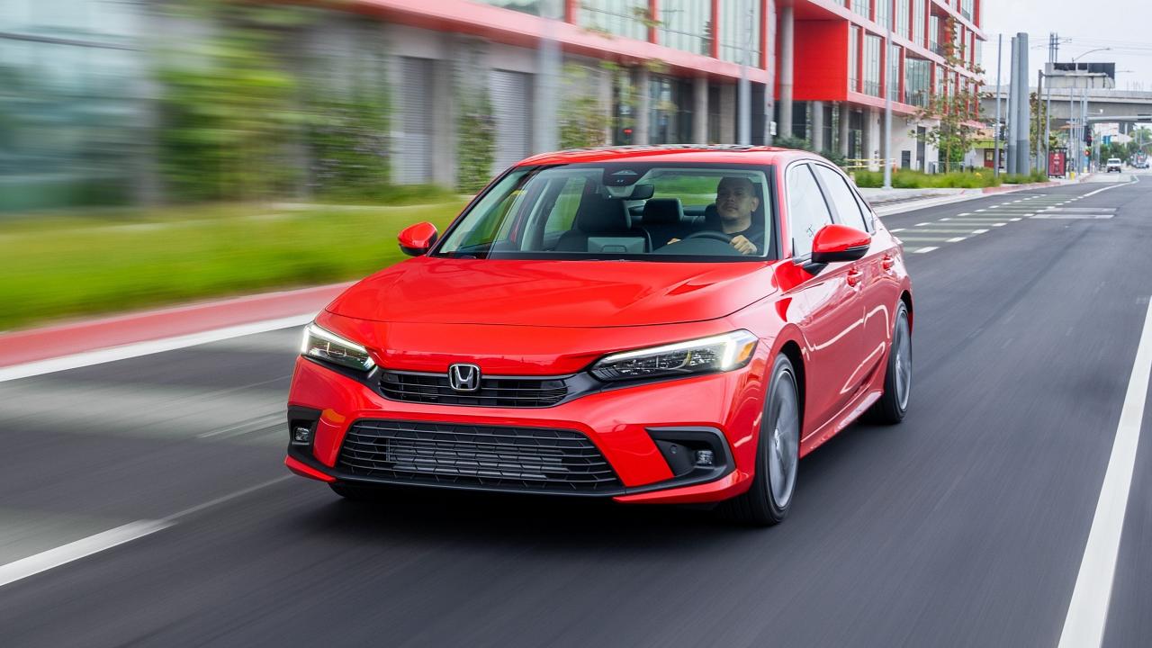 2024 Honda Civic Sedan driving in a city