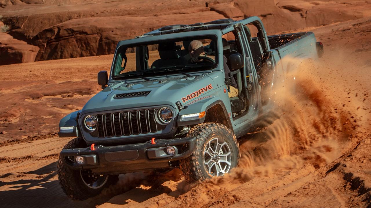 2024 Jeep Gladiator driving through sand