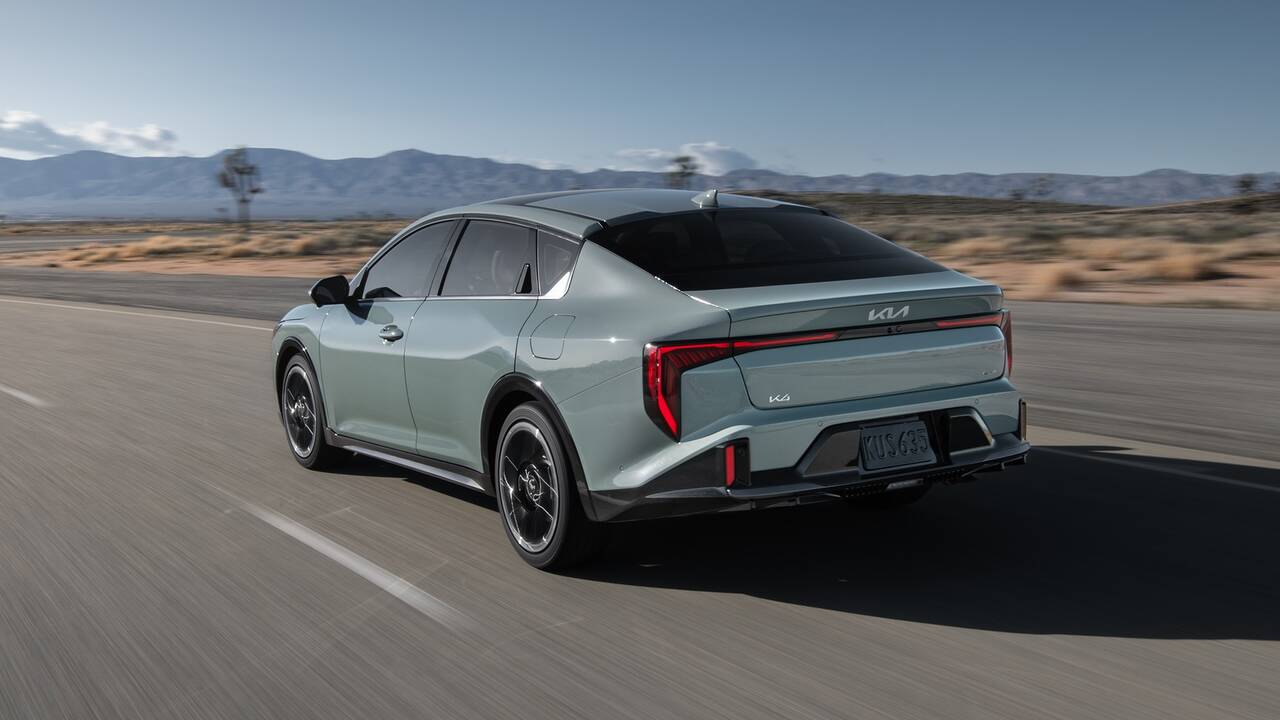 2025 Kia K4 driving rear view