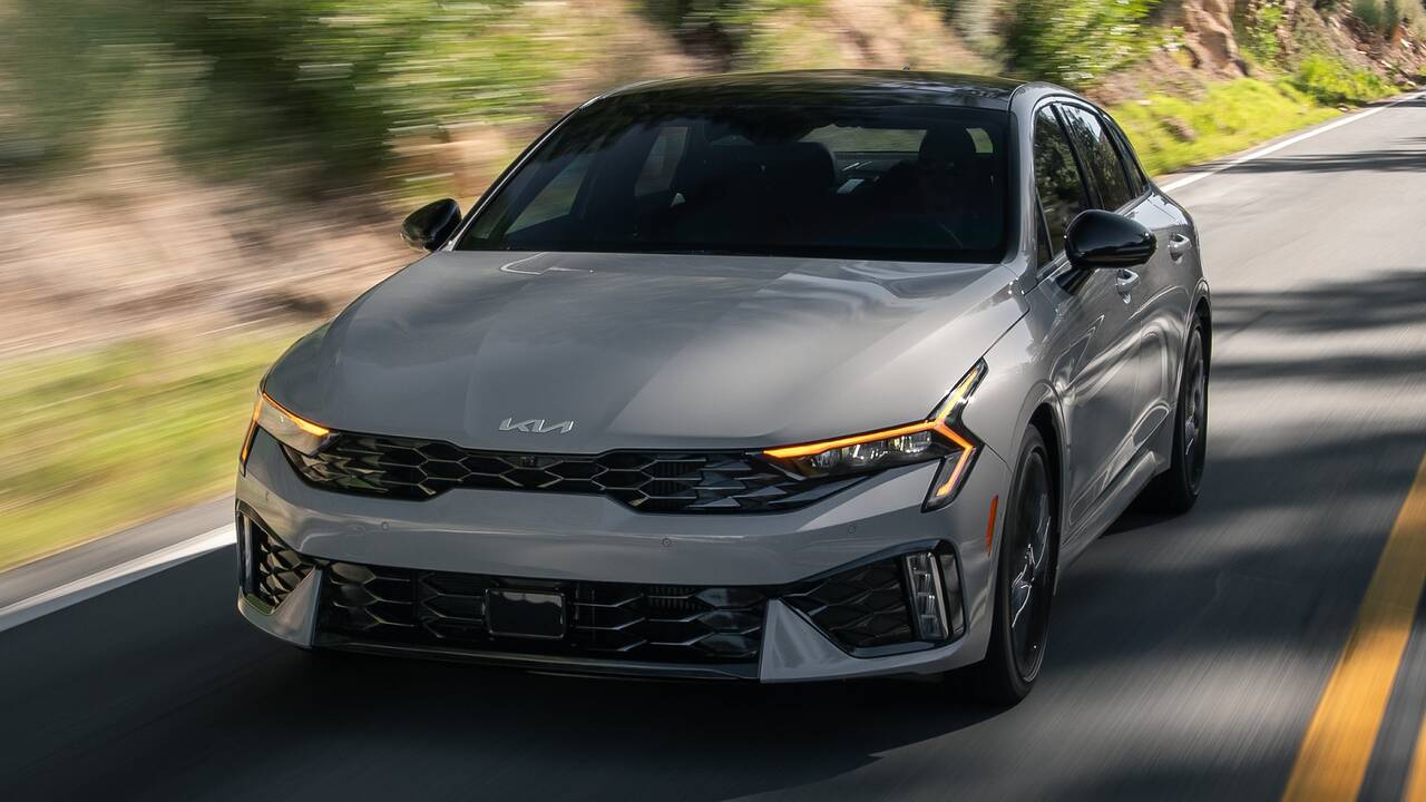 2025 Kia K5 GT driving front view closeup