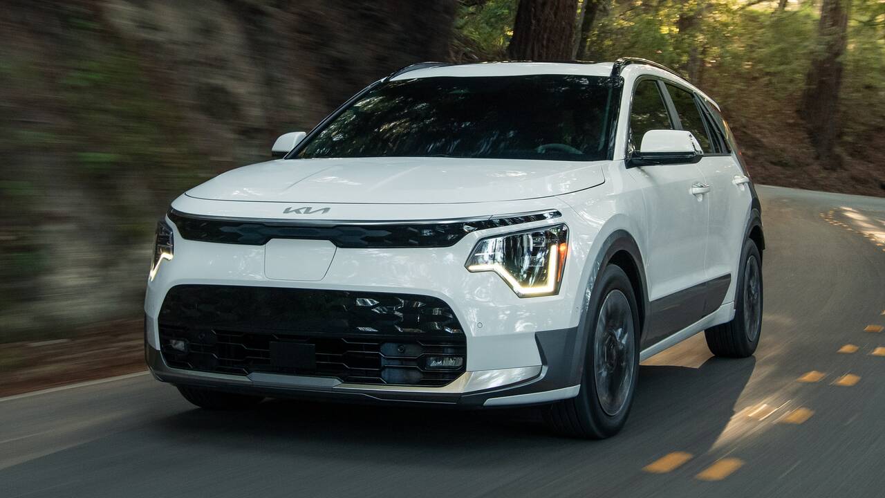 2024 Kia Niro EV driving through the woods