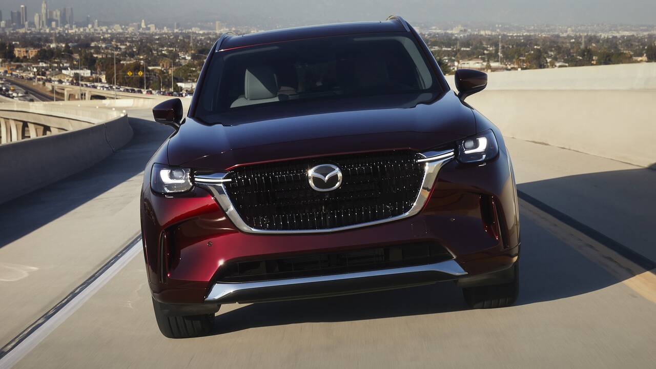 2025 Mazda CX-90 driving, head-on view