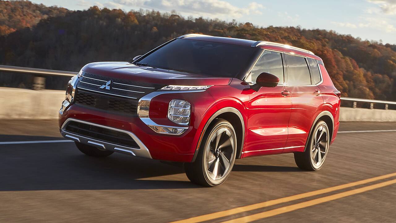 2024 Mitsubishi Outlander driving on a bridge front view