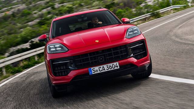 2025 Porsche Cayenne GTS driving front view hard cornering