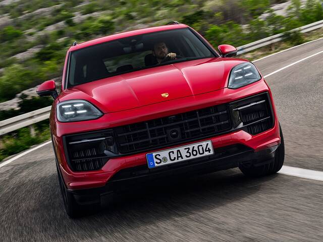 2025 Porsche Cayenne GTS driving front view hard cornering
