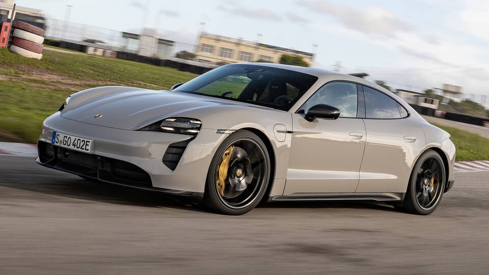 2024 Porsche Taycan sedan driving front view