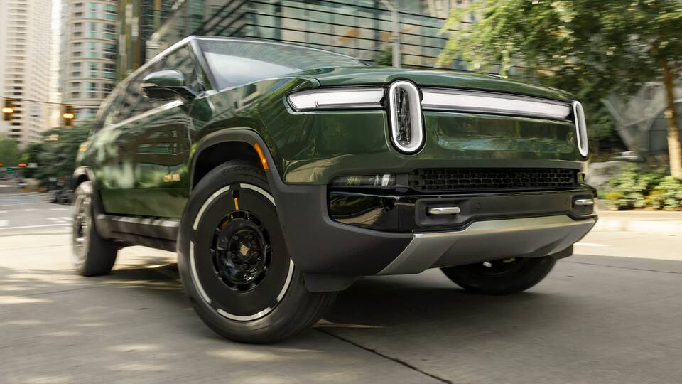 2025 Rivian R1S driving front view closeup