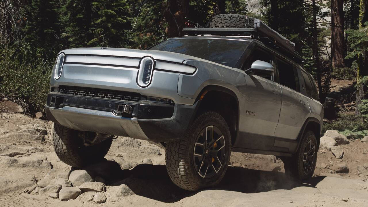 2025 Rivian R1S driving off road front view