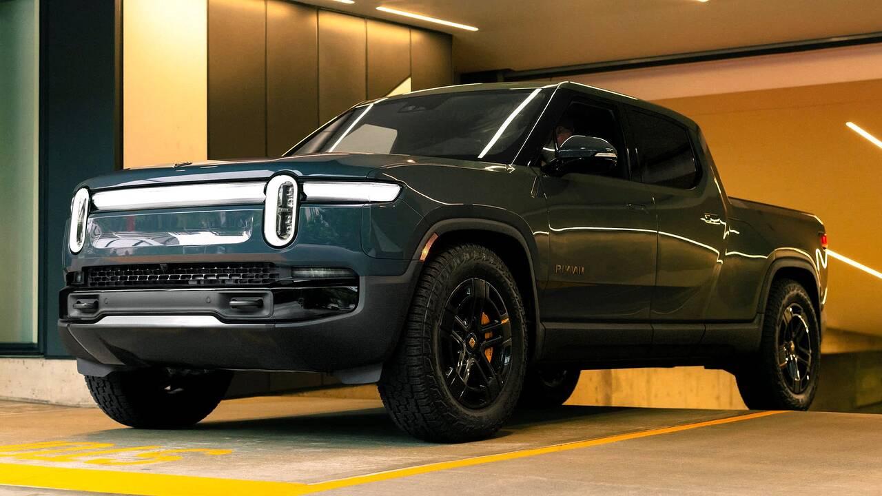 2025 Rivian R1T driving front view