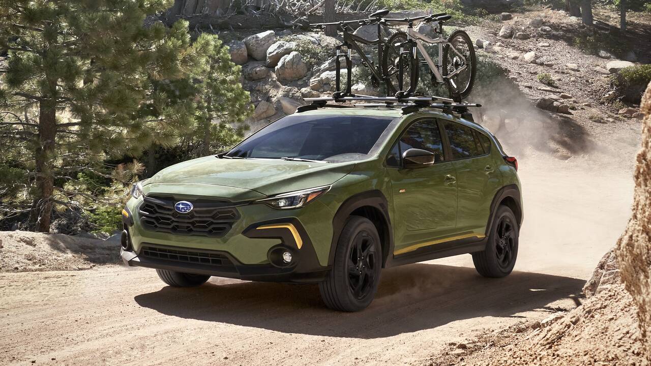 2024 Subaru Crosstrek Sport driving off-road front view