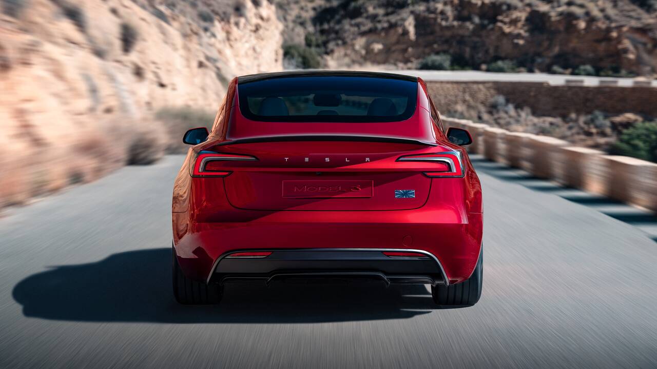 2024 Tesla Model 3 driving rear view