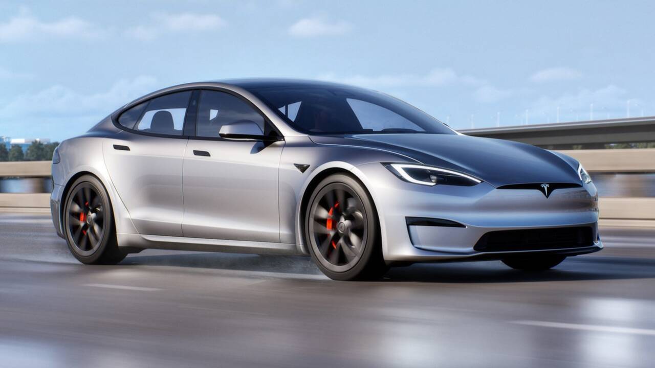 2025 Tesla Model S Plaid driving front view - silver