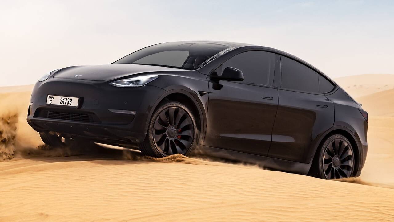 2024 Tesla Model Y driving off road - front view