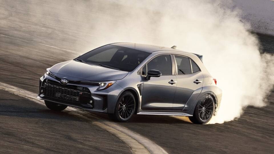 2024 Toyota GR Corolla driving sideways on a racetrack