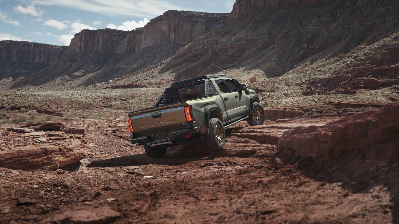 2024 Toyota Tacoma Trailhunter driving off road rear view