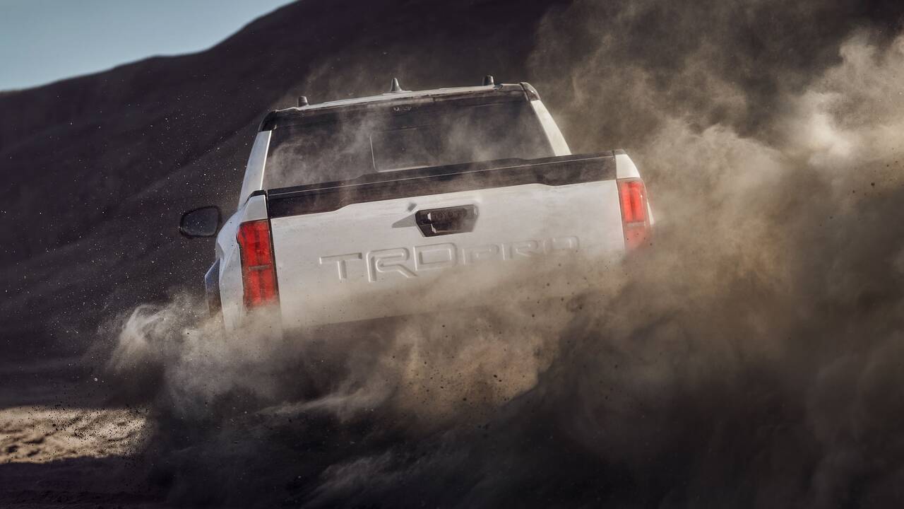 2025 Toyota Tacoma driving off-road rear view closeup